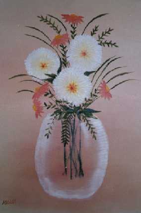 White pom pom flowers in glass vase