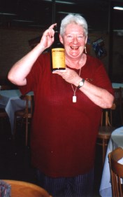 Annie with a bottle of Prisoner port