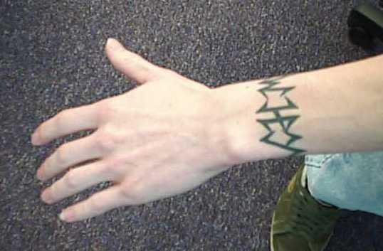 another tattoo: a self designed tribal-esque wristband on my left wrist.