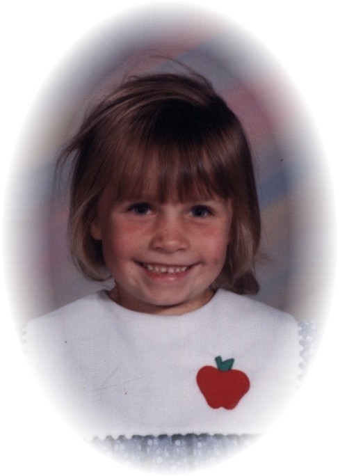At age 4     Her first school picture