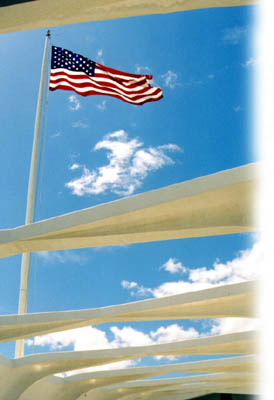 U.S. flag flown over the USS Arizona memorial in Pearl Harbor, Hawaii