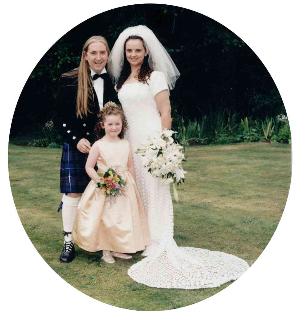 copyright Mate Gibb Photography 1999              The Bride and groom with their pretty Flower Girl, Emma Eldridge.