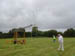 Graham GW3SIY rolls up the 80m wire dipole with Phil GW4HAT in background