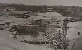 The construction of the present dam at Ludington State Park Dam, completed in 1912.