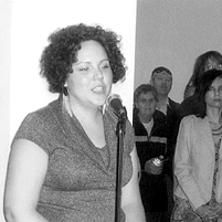 Bobbie Maxwell sings the National Anthem in Ojibway at the opening of the Angele Project Art Exhibition.