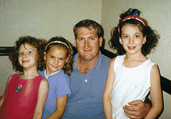 Photo of musician with three little girls