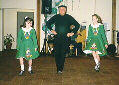 photo of me & my sister dancing with our priest