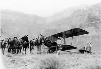 THE FIRST AND ONLY AIRPLANE TO LAND WITHIN THE CANYON AT PLATEAU POINT. PILOT: R.V. THOMAS. FRED HARVEY MULES ON LEFT. 08 AUG 1922. FRED HARVEY PHOTO. (SEE ALSO 5255. 