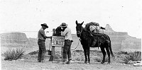 MEN WORKING ON AN EMERGENCY PHONE ON THE  S KAIBAB TRAIL, TONTO PLATEAU. DETAIL OF INSTRUCTIONAL  SIGN. CIRCA 1937. NPS.