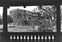 HOPI HOUSE SEEN FROM EL TOVAR PORCH. PORCH RAILING DESIGN SHOWN IN SILHOUETTE. CIRCA 1906. DETROIT PUBLISHING. 