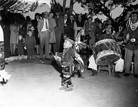 HOPI HOUSE TOURIST INDIAN DANCE. 2 YEAR OLD RONALD TIMECHE PERFORMS EAGLE DANCE. CIRCA 1950. SANTA FE RR PHOTO.