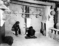MALE HOPI WEAVES A WIDE SASH IN HOPI HOUSE &quotBLANKET WEAVER." BASKETS HUNG ON WALLS. CIRCA 1905  DETROIT PHOTOGRAPHIC. GRCA 15803<br>
