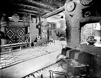 MARY COLTER INTERIOR DECORATION IN HOPI HOUSE. POT IN WINDOW. RUG ON LOOM. CIRCA 1905. DETROIT PHOTOGRAPHIC. GRCA 15803D