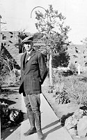 STEVEN T. MATHER, FIRST DIRECTOR OF THE NPS, DRESSED FOR GRAND CANYON NATIONAL PARK'S  DEDICATION.  POSE BY HOPI HOUSE. 30 APR 1920. MCCLINTOCK.
