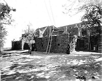 LOOKING NE AT FRONT OF HOPI HOUSE. CAGE FOR EAGLES ? ON ROOF. GRCA 64886A. 14 NOV 1906. PUTNAM AND VALENTINE.