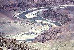 TELEPHOTO OF COLORADO RIVER FROM LIPAN POINT. UNKAR DELTA AND RAPIDS. 2,500 CFS LOW WATER FLOW. 9 JULY 1963. NPS, BEAL.