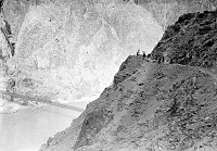 CONSTRUCTION OF RIVER TRAIL BY CCC ENROLLEES. OVERVIEW OF PICK & SHOVEL WORK. BLACK BRIDGE AND RIVER BELOW. CIRCA 1935. NPS