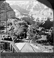 LOOKING FROM THE SECOND FLOOR BALCONY OF THE EL TOVAR HOTEL DOWN PAST THE FLAGPOLE & N. INTO THE CANYON. FROM STEREOVIEW. &quotA SUBLIME SPECTACLE - ACROSS THE CANYON FROM EL TOVAR ON S RIM. CIRCA 1925. KEYSTONE STEREOGRAPH.