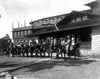 WELL DRESSED TRAIL PARTY OF 14 POSING ON MULES BY THE MAIN ENTRANCE TO THE EL TOVAR HOTEL. 1908 