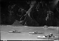 FIRST NEVILLS COLORADO RIVER EXPEDITION. 3 BOATS, 5 PEOPLE ON THE RIVER PULLING INTO A BEACH BY PHANTOM RANCH. 22 JUL 1938 NPS PHOTO