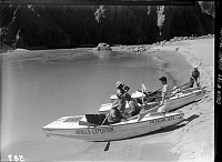 FIRST NEVILLS COLORADO RIVER EXPEDITION. 5 PEOPLE IN 3 BOATS  MOORED AT A BEACH NEAR PHANTOM RANCH. 22 JUL 1938 NPS PHOTO