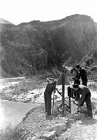 CCC ENROLEES SURVEYING FROM THE COLORADO RIVER TO YAKI POINT ON THE S RIM. CIRCA 1935 NPS PHOTO