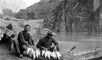 2 MEN WITH A STRING OF HUMPBACK CHUB FISH & COLLAPSIBLE BOAT. COLORADO RIVER NEAR PHANTOM RANCH. CIRCA 1911. RUST COLLECTION. 