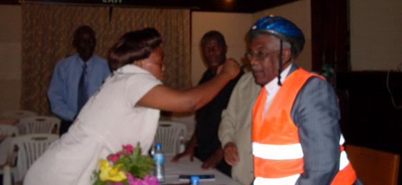 UWABA present helmet and reflective jacket to the Mayor of Tanga, Hon. Kisauji