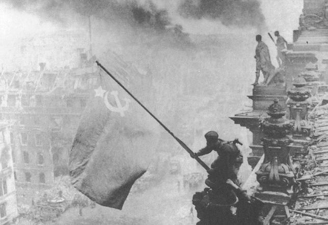 Red Army raising the Soviet standard over the Reichstag. (Berlin Germany, 1945)