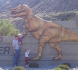 Standing in front of Drumheller sign